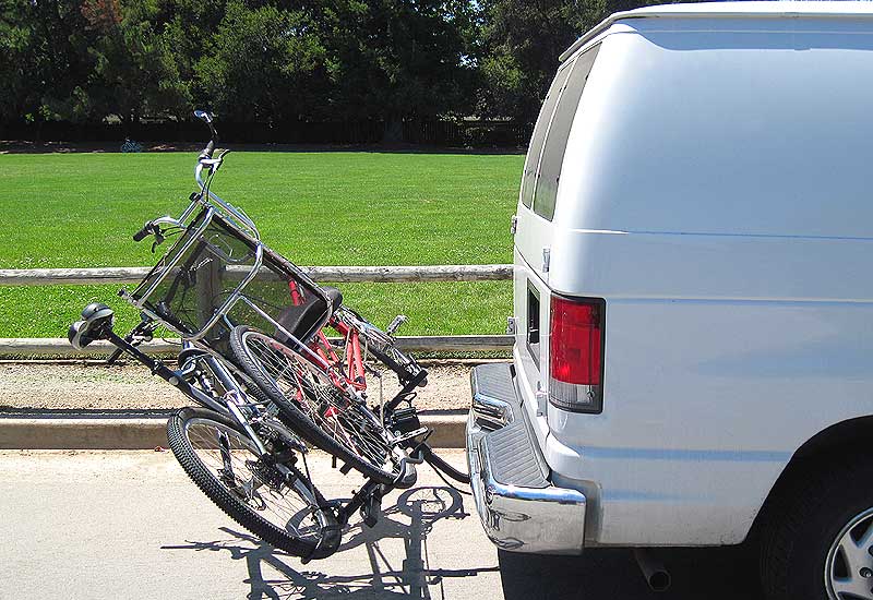 Recumbent bike and mountain bike on platform bike rack