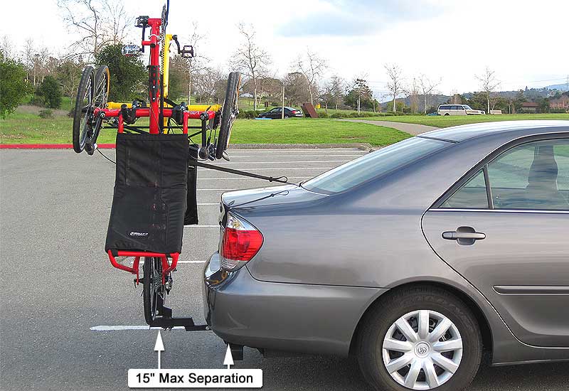 Trike carrier with 2 tadpole trikes mounted vertically